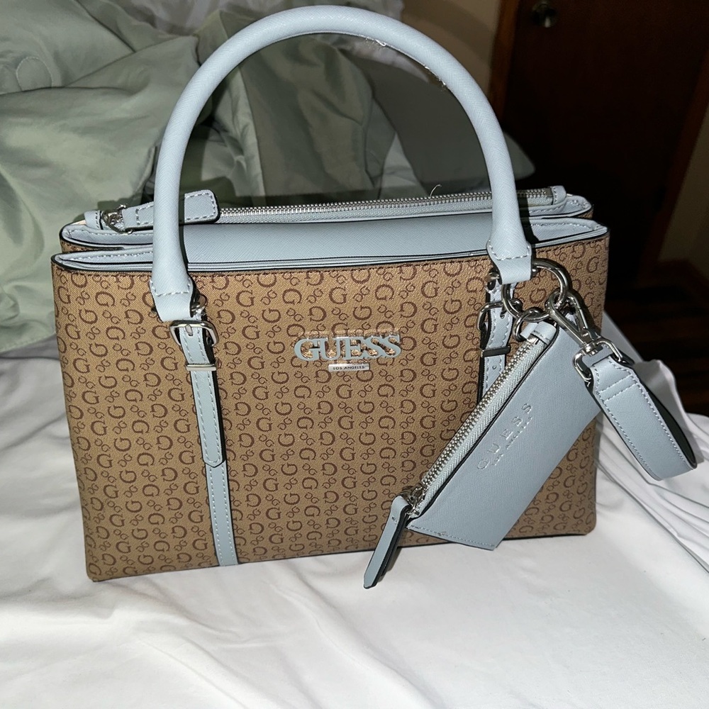 Guess purse: tan and Baby Blue. Medium size with shoulder strap.